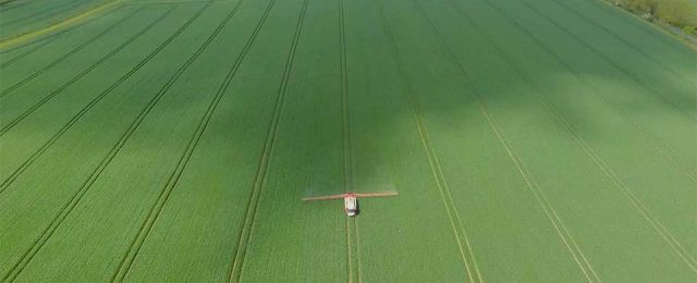 aerial video of michael crop spraying in glatton